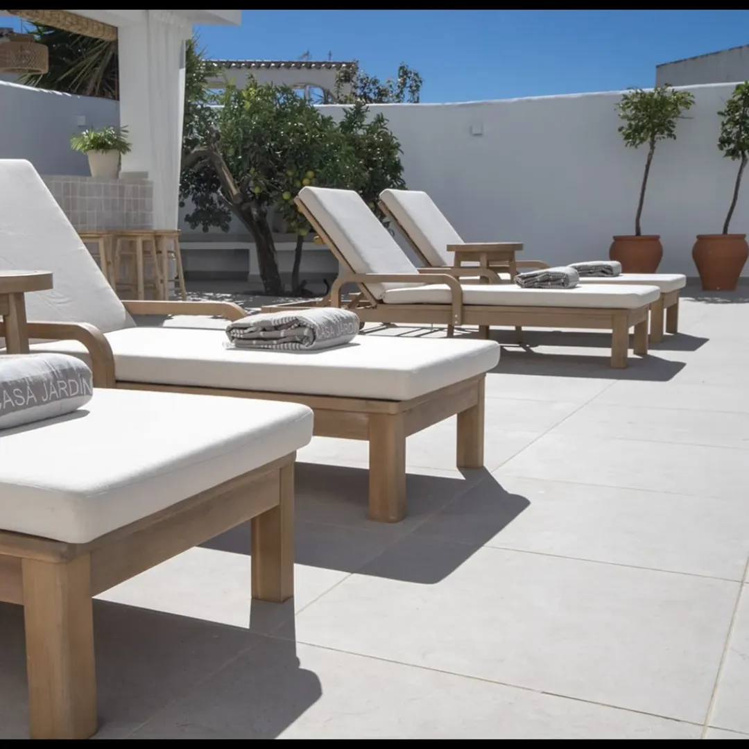 Sun loungers with fresh towels by the pool.