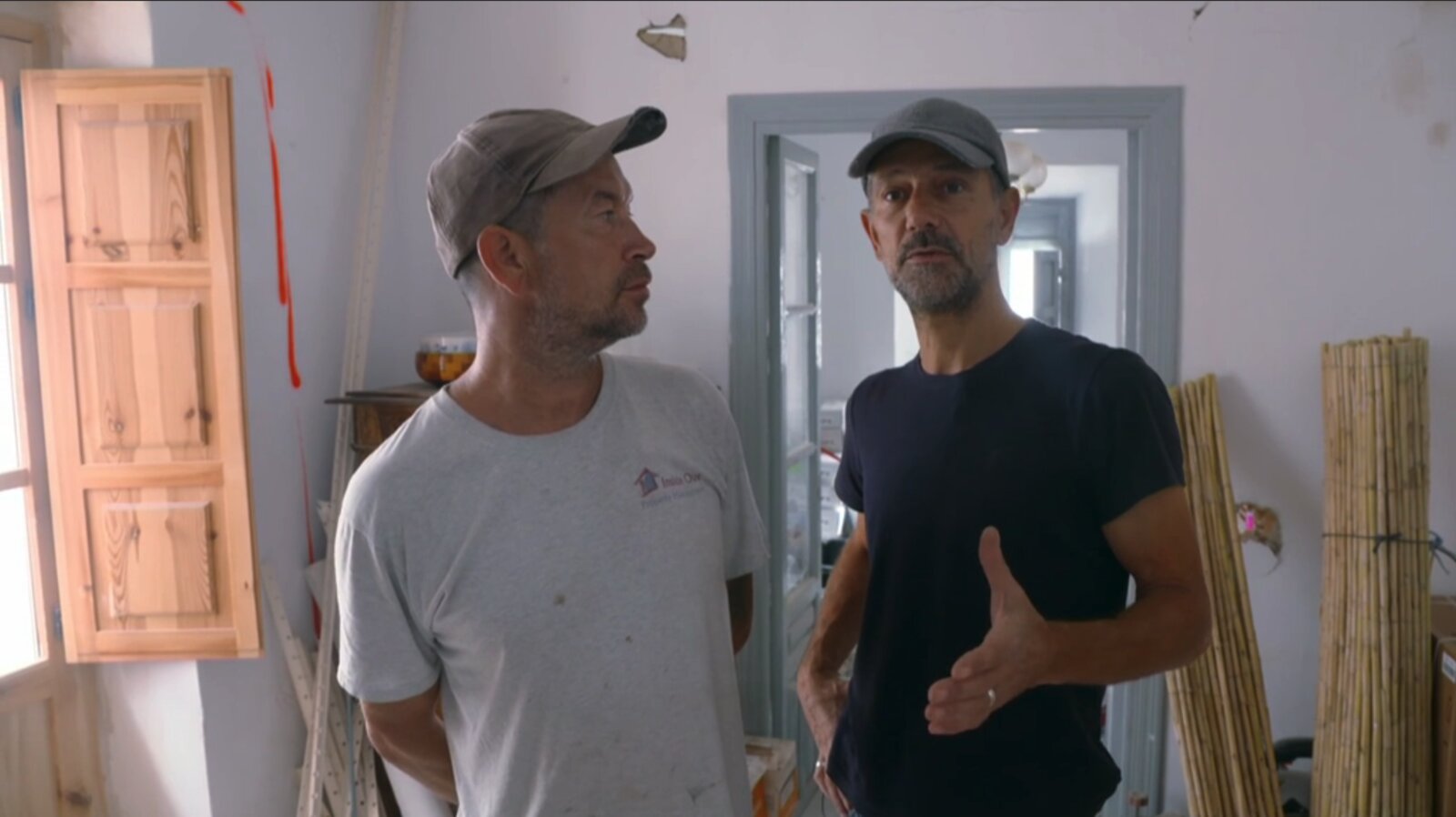 Ian deep in conversation with a Spanish tradesman during the renovation of Casa Jardín.